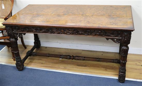 A mid-Victorian carved walnut library table W.152cm
